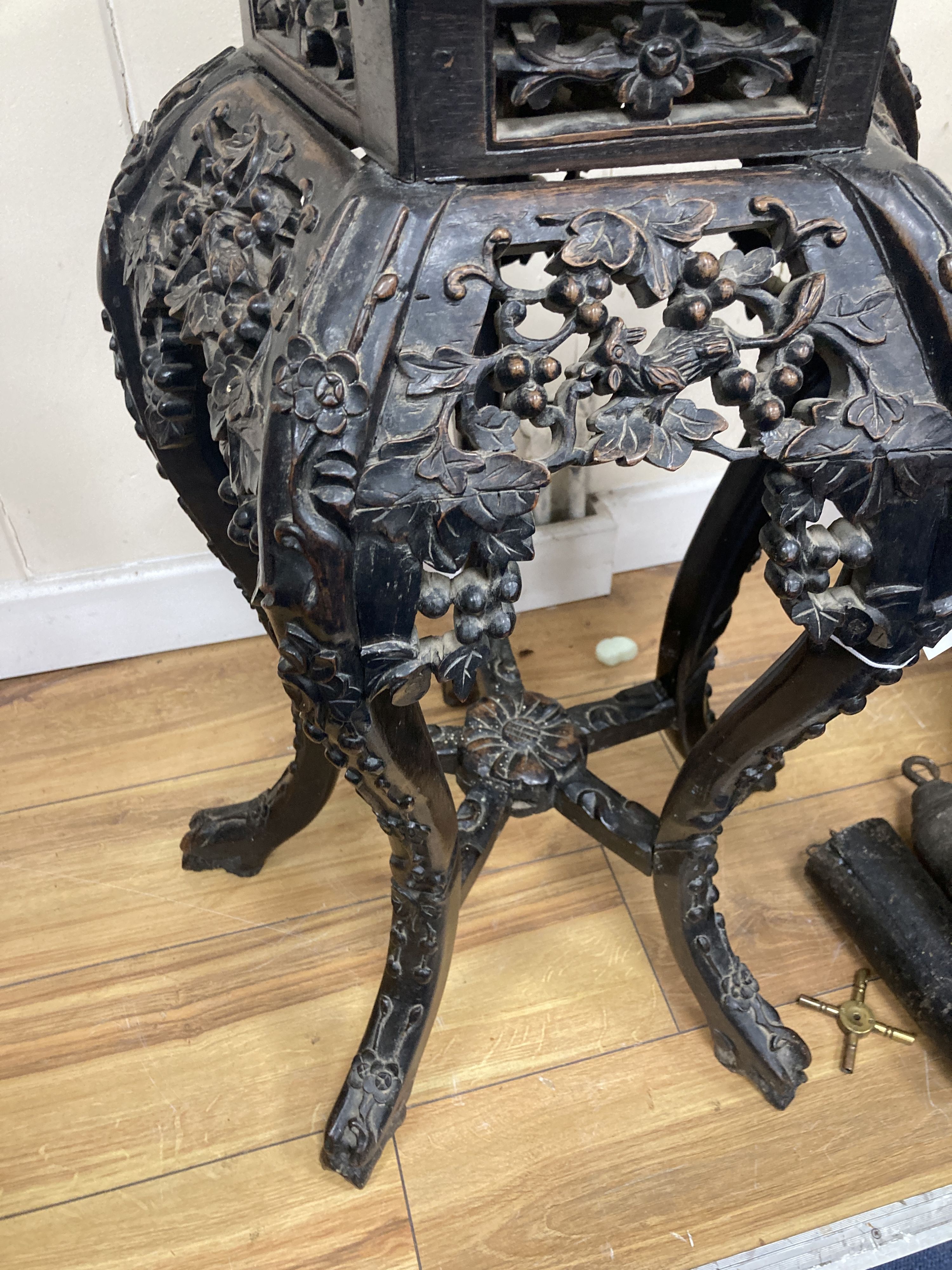 A Chinese marble top carved hardwood jardiniere stand, width 38cm, depth 38cm, height 66cm